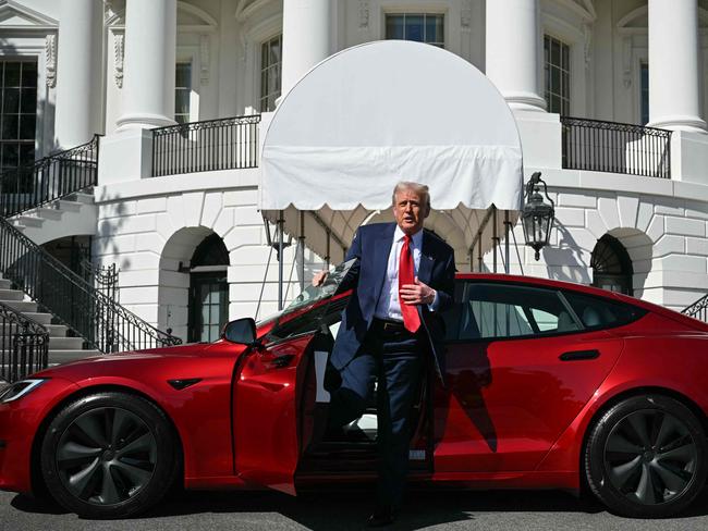 US President Donald Trump speaks to the press as he exits a Tesla vehicle on the South Portico of the White House in Washington, DC. Picture: AFP