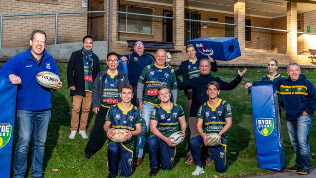 Cr Trenton Brown, Cr Peter Kim, Cr Roy Maggio, Cr Sarkis Yedelian OAM, Cr Chris Moujalli, Warren Price President on the goalpost cover Rear Clr Simon Zhou – Clayton James Secretary -Clr Jordan LaneÃ&#138;allÃ&#138;pose for a photo outside Harry Anderson Park Pavilion in Ryde Park on Friday, 26 June 2020. The Council waives fees for sports clubs. (AAP Image / Monique Harmer)