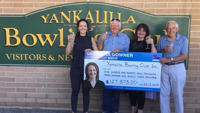 Liberal candidate Georgina Downer. left, was rightly promoting a government commitment when she handed out a cheque for a grant, says cabinet minister Simon Birmingham. Picture: Twitter