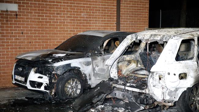 Two cars destroyed by fire in a driveway of a unit complex in Chipping Norton. Picture: Steve Tyson