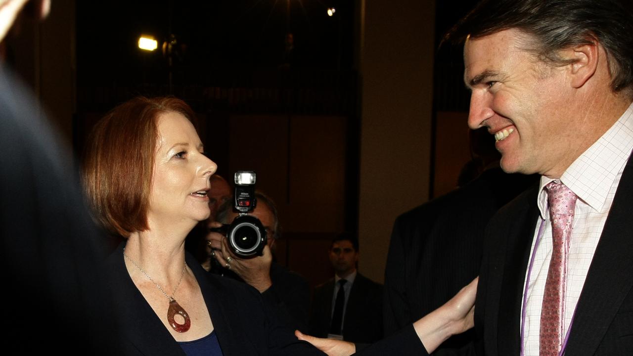 PM Julia Gillard and independent MP Rob Oakeshott talking at the end of the Tax Forum at Parliament House in Canberra.