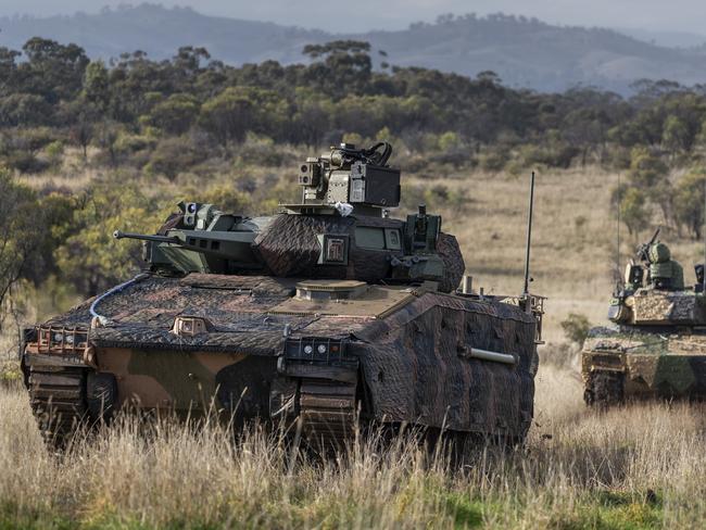 Hanwha Defense Australia Redback Infantry Fighting Vehicle (front) and Rheinmetall Defence Australia LYNX KF41 Infantry Fighting Vehicle (back), conduct LAND 400 Phase 3 user evaluation trials at Puckapunyal Military Area, Victoria. *** Local Caption *** Valued at between $18.1 billion and $27.1 billion, LAND 400 Phase 3 is the largest acquisition project in the Australian Armyâs history. The contenders for a new Infantry Fighting Vehicle are the Hanwha Defense Australia Redback and the Rheinmetall Defence Australia KF41 Lynx. Both tenderers have each delivered three prototype vehicles which are being extensively tested as part of a two-year Risk Mitigation Activity. Captured in this collection are activities undertaken at Puckapunyal, Victoria in June 2021, including extensive user evaluation trials and a live fire event. A decision on the preferred tenderer is expected to be presented to Government for consideration in 2022.