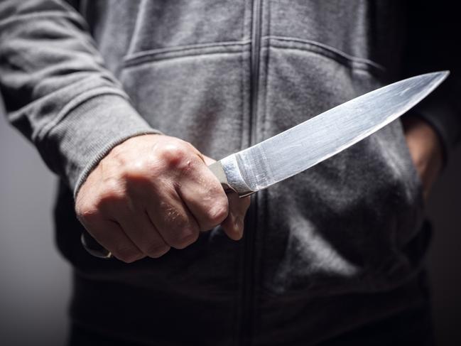 Generic crime Istock  -  Criminal with knife weapon threatening to stab