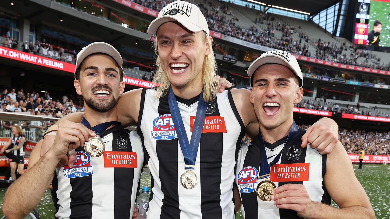 Nick Daicos, Darcy Moore and Josh Daicos celebrate after the final siren of the 2023 Grand Final. Will they be doing the same after the last day in September in 2024? Picture: Michael Klein