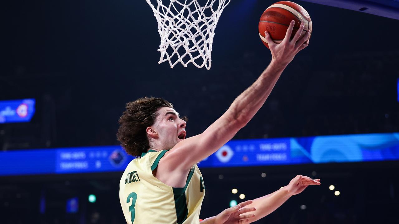 OKINAWA, JAPAN - AUGUST 29: Josh Giddey #3 of Australia drives to the basket against Keisei Tominaga #30 of Japan during the FIBA Basketball World Cup Group E game between Australia and Japan at Okinawa Arena on August 29, 2023 in Okinawa, Japan. (Photo by Takashi Aoyama/Getty Images)