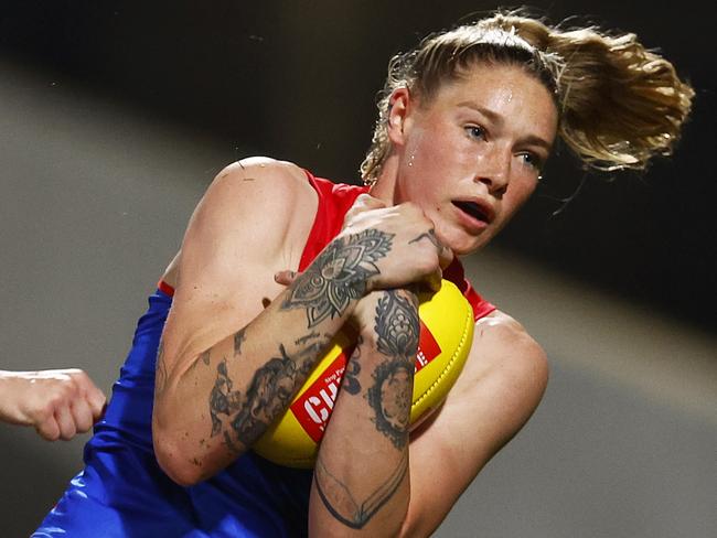 MELBOURNE, AUSTRALIA - SEPTEMBER 23: Tayla Harris of the Demons marks the ball during the round five AFLW match between the Carlton Blues and the Melbourne Demons at Ikon Park on September 23, 2022 in Melbourne, Australia. (Photo by Daniel Pockett/AFL Photos/via Getty Images)