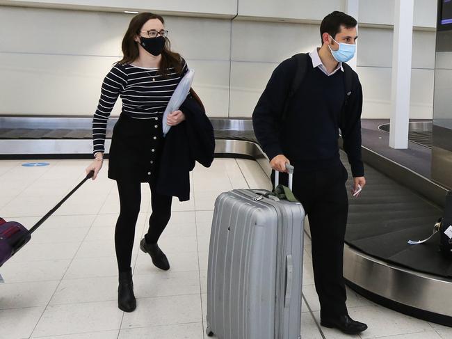 SYDNEY, AUSTRALIA - NewsWire Photos MAY 12, 2021: Alice Dirks and her partner Richard Carnovale arrive in to Sydney Airport today. People are continuing to travel interstate despite news of a man who tested positive for the Corona Virus following his Melbourne hotel quarantine period, in Sydney, Australia. Picture: NCA NewsWire / Gaye Gerard