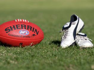 Generic AFL Sherrin football and football boots. sport /