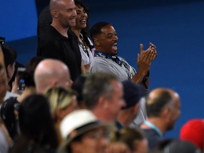 American actor Will Smith is acknowledged during a post match interview by Nick Kyrgios. Picture: AAP/Dean Lewins