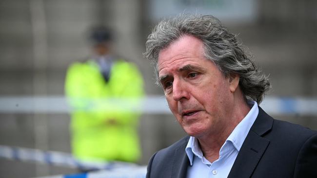 Mayor of Liverpool City Region, Steve Rotherham, talks to members of the media beside a police cordon on Water Street in Liverpool. Picture: AFP
