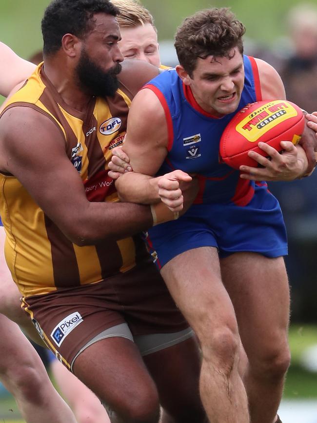 Kiewa-Sandy Creek’s Zachary Mona tackles a Beechworth opponent. Pictures: Yuri Kouzmin