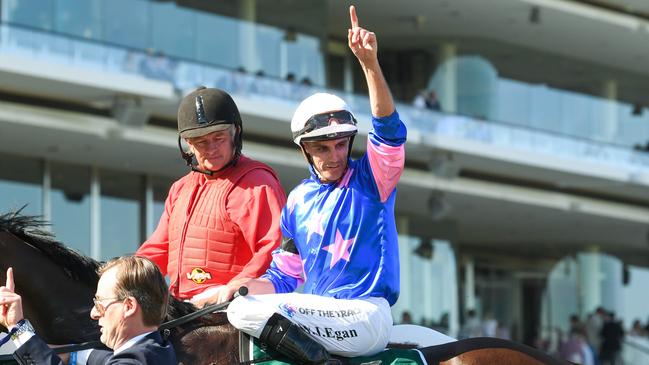 Billy Egan returns with a salute after winning the Australian Guineas aboard Feroce Picture: Brett Holburt