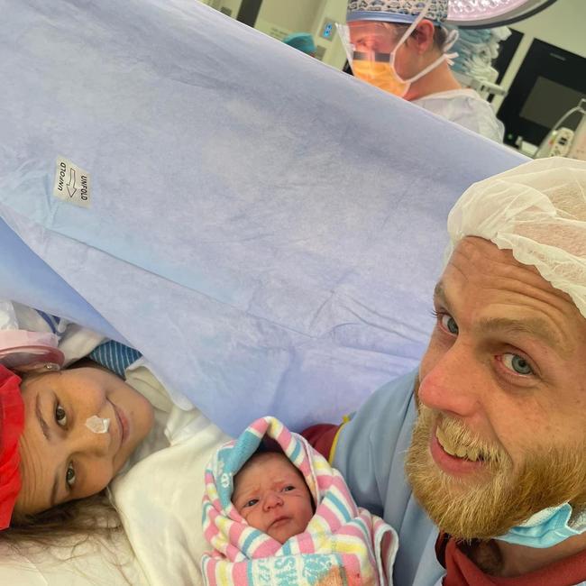 Mum and dad with their new baby girl, Willow Rose, after an emergency C-section at Port Macquarie Base Hospital.