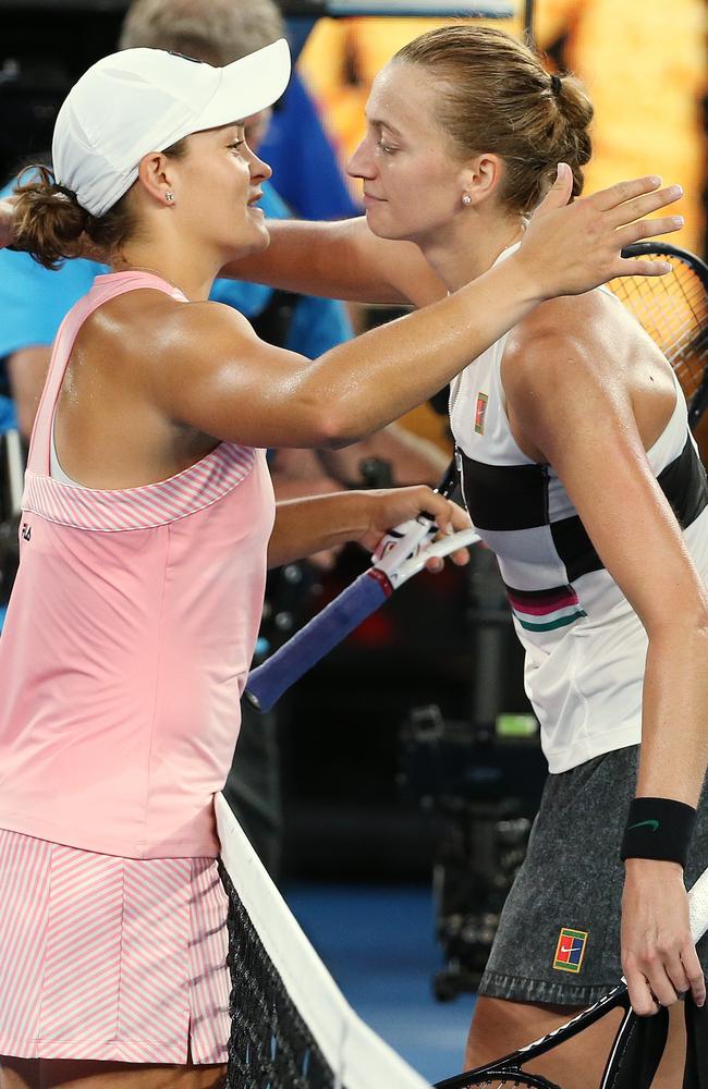 Petra Kvitova, right, in an accidental ode to the 80s with acid wash denim and sweatbands. Picture: Michael Klein