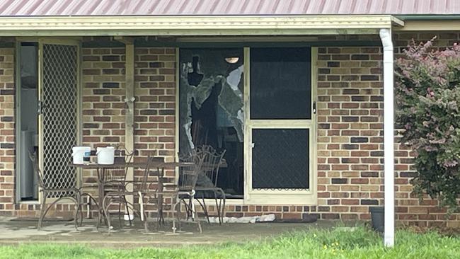 The smashed glass door at the Beerwah home. Picture - Iwan Jones.