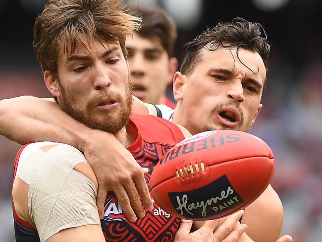 Jack Viney of the Demons (left) and Sam Powell-Pepper of the Power contest during the Round 18 AFL match between the Melbourne Demons and the Port Adelaide Power at MCG in Melbourne, Saturday, July 22, 2017. (AAP Image/Julian Smith) NO ARCHIVING, EDITORIAL USE ONLY