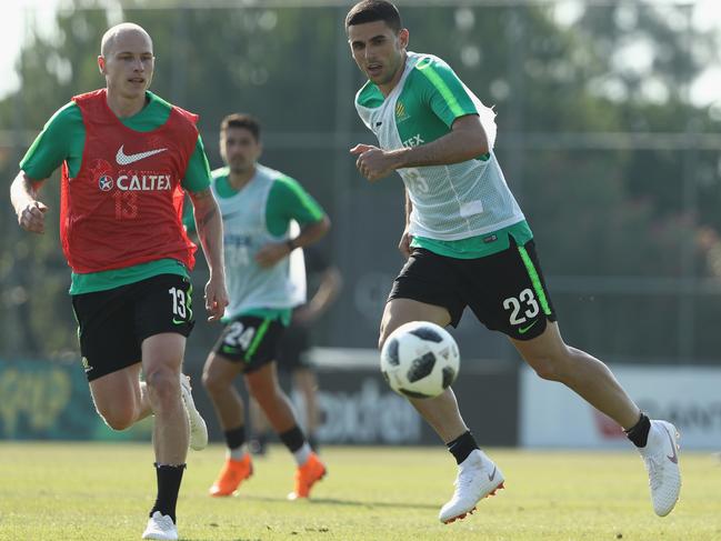 ANTALYA, TURKEY - JUNE 03: Tom Rogic of Australia is chased by Aaron Mooy of Australia during the Australian Socceroos Training Session at the Gloria Football Club on June 3, 2018 in Antalya, Turkey.  (Photo by Robert Cianflone/Getty Images)