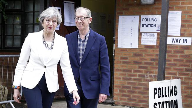 Britain's Prime Minister Theresa May leaves with her husband Philip after voting in the general election. Picture: AP