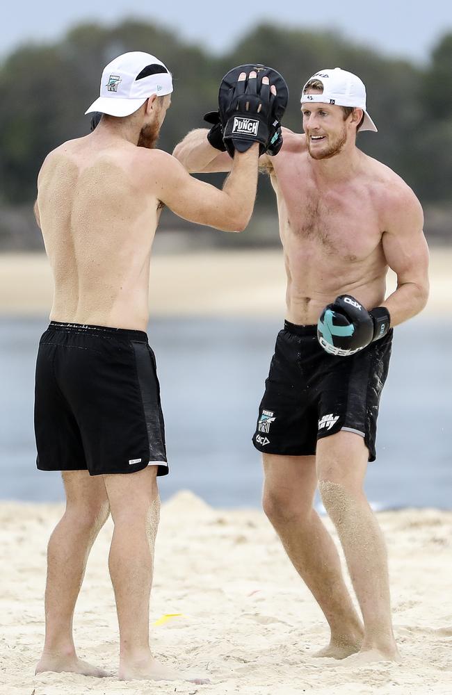 Jonas and Robbie Gray boxing on the beach in Noosa. Picture: Sarah Reed.