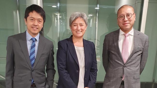 Ted Hui, left, and Kevin Yam with Foreign Minister Penny Wong in January at the Australian government offices in Adelaide. On Monday, the Hong Kong police announced the two have been accused of ‘collusion’.