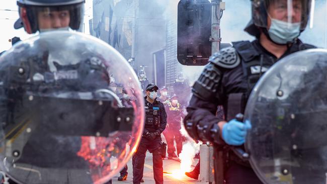 Protesters through flares and glass bottles at Victorian police. Picture: NCA NewsWire/Sarah Matray