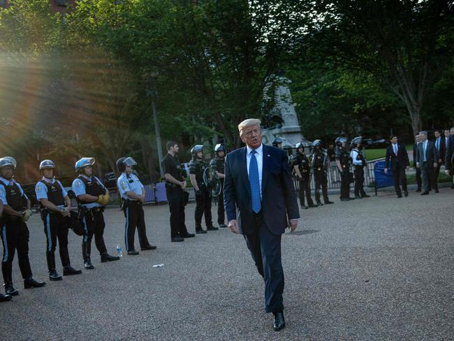 US President Donald Trump leaves the White House on foot to go to St John's Episcopal church across Lafayette Park in Washington, after his address. Picture: AFP