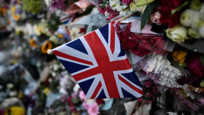 Floral tributes are seen outside Buckingham Palace in London on September 9. Picture: AFP