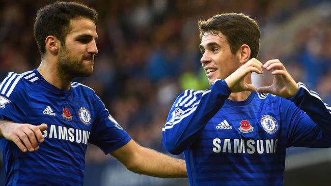 Oscar of Chelsea celebrates his goal with Cesc Fabregas.
