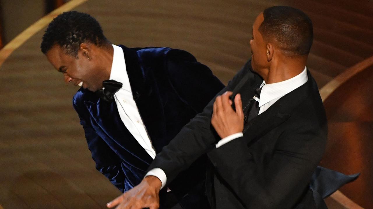 Will Smith (R) slaps US actor Chris Rock onstage during the 94th Oscars at the Dolby Theatre in Hollywood, California. (Photo by Robyn Beck / AFP)