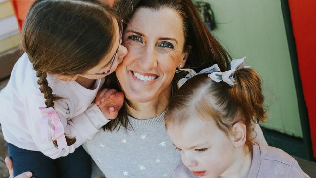 Australian Olympic aerial skier and five-time world title winner, Jacqui Cooper, with children Madeline (left) and Grace.