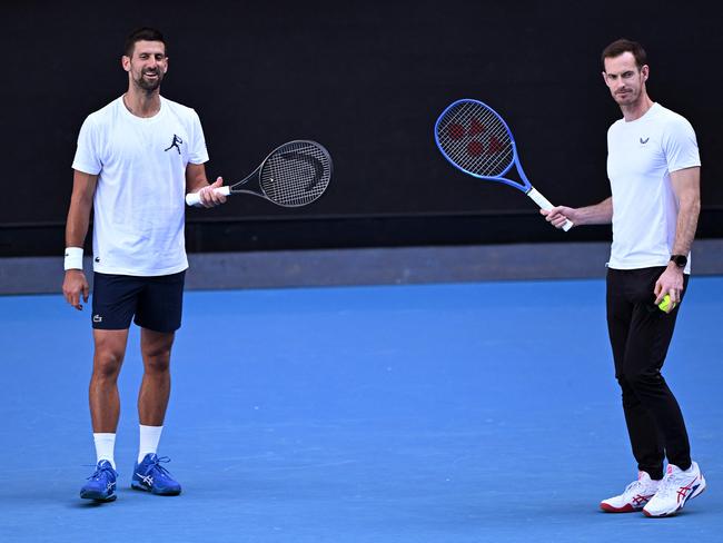 Novak Djokovic of Serbia (L) and coach Andy Murray look on during a training session ahead of the Australian Open tennis tournament in Melbourne on January 7, 2025. (Photo by William WEST / AFP) / --IMAGE RESTRICTED TO EDITORIAL USE - STRICTLY NO COMMERCIAL USE--