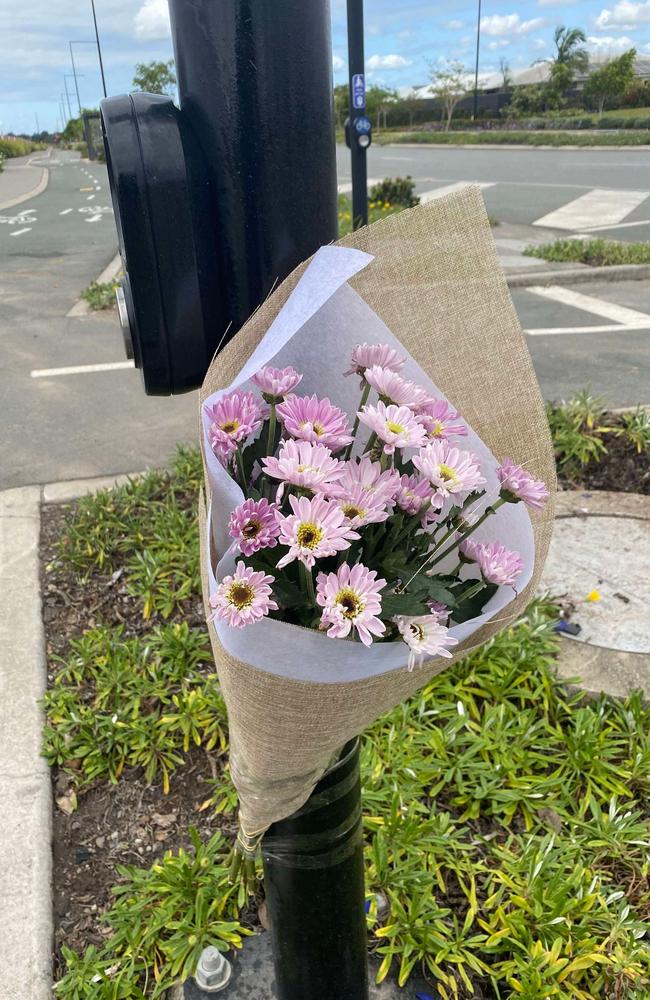 Flowers were left at the site of a crash in Nirimba which killed a 17-year-old boy and a motorcyclist.