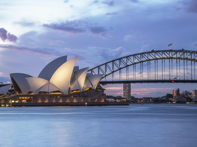 Sydney, NSW, Australia - November 2, 2015: Sydney Opera House and Sydney Harbour Bridge illuminated at dusk