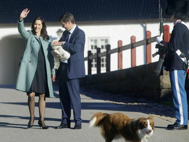 Then Crown Prince Frederik holds his new born son next to Crown Princess Mary while Ziggy looks on. Picture: AFP.