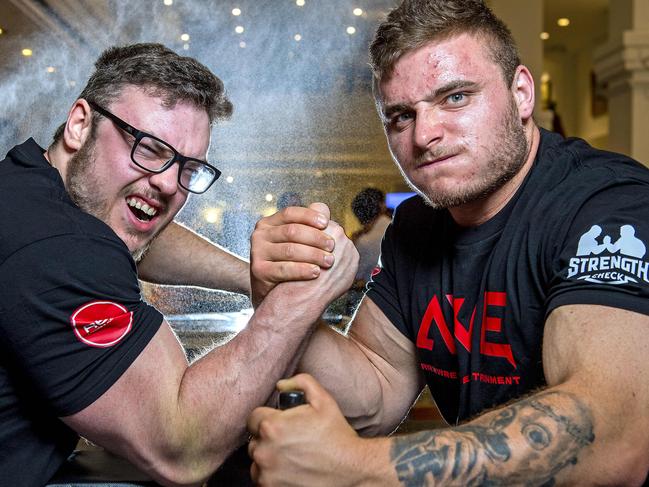 Arm wrestlers Taran Broad and Thylor Harrison at Sebastyan's Bar at the Grand Chancellor Hotel .Tuesday,October,22,2024.Picture Mark Brake