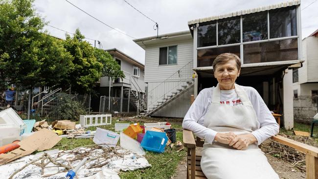 Nataliya Bolsunovska of the Brisbane suburb of Carina takes a break from cleaning flood damage in the wake of ex Tropical Cyclone Alfred. Picture Lachie Millard