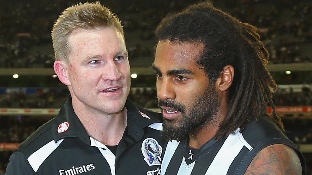 Nathan Buckley, coach of the Magpies, with Heritier Lumumba. Photo by Quinn Rooney/Getty Images