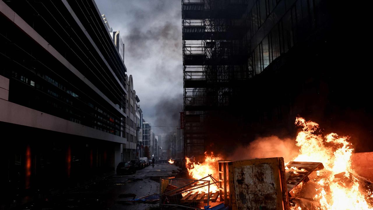 Scenes in Brussels showed burning wood pallets and violent clashes between police and protesters. Picture: Kenzo Tribouillard/ AFP.