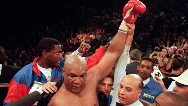 Referee Joe Cortez holds George Foreman’s arm up in victory after Foreman knocked Michael Moorer out in 1994. Picture: John Gurzinski/AFP/Getty Images