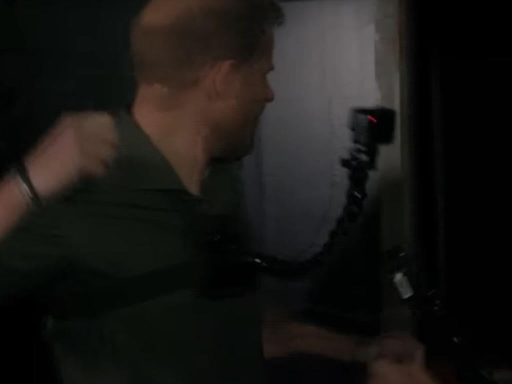 Prince Harry goes to punch a spooky figure that took him by surprise.