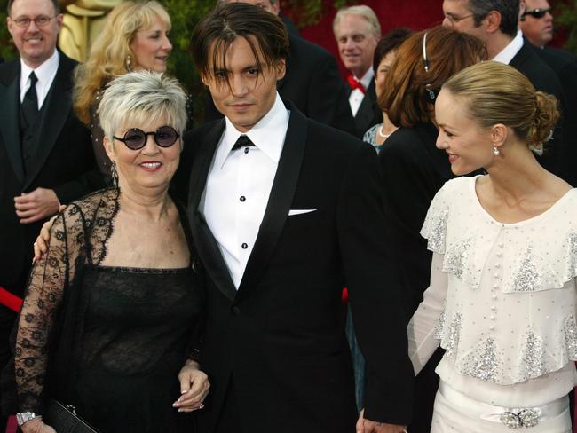 Johnny Depp with his late mother, Betty Sue, and former love Vanessa Paradis, with whom he shares two teenage children. Picture: Frank Micelotta/Getty Images