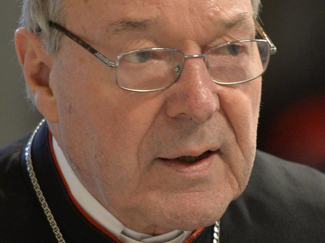 (FILES) This file photo taken on April 2, 2015 shows Australian Cardinal George Pell, Prefect of the Secretariat for the Economy of the Holy See arriving to attend a Chrism mass for Holy Thursday (Maundy Thursday) which marks the start of Easter celebrations at St Peter's basilica in Vatican. Pell on May 21, 2015 denied trying to bribe a victim of a paedophile priest to keep him quiet as abuse survivors demanded he return to Australia to give evidence to a royal commission on the allegations against priest uncle Gerald Ridsdale, a notorious paedophile now in jail. AFP PHOTO / FILES / ANDREAS SOLARO