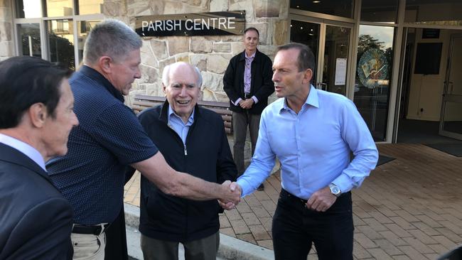 Former Prime Minister John Howard and Tony Abbott on Election Day. Picture: Ben James