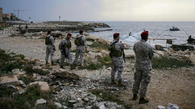 Lebanese soldiers inspect the beach of the reported landing site for the “naval commando force” while a military source said an investigation was underway to determine whether the operation was carried out by Israel. Picture: Ibrahim Chalhoub/AFP