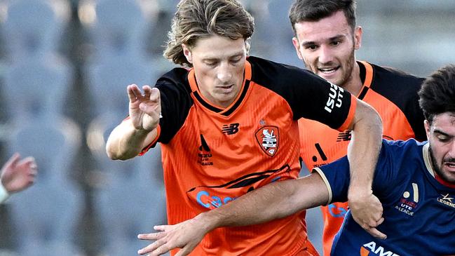 BRISBANE, AUSTRALIA - APRIL 08: Jez Lofthouse of the Roar and Kostandinos Grozos of the Jets challenge for the ball during the round 23 A-League Men's match between Brisbane Roar and Newcastle Jets at Kayo Stadium, on April 08, 2023, in Brisbane, Australia. (Photo by Bradley Kanaris/Getty Images)