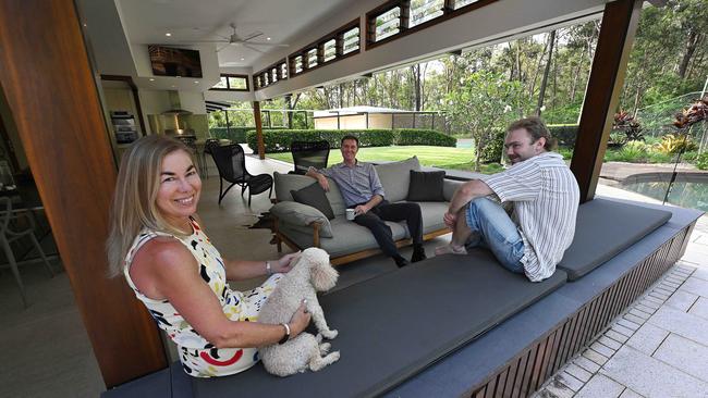 Megan and Brett Williamson, son Cormac, and their dog Lila, at their home which they are selling in Kenmore Hills, Brisbane. pic: Lyndon Mechielsen/Courier Mail