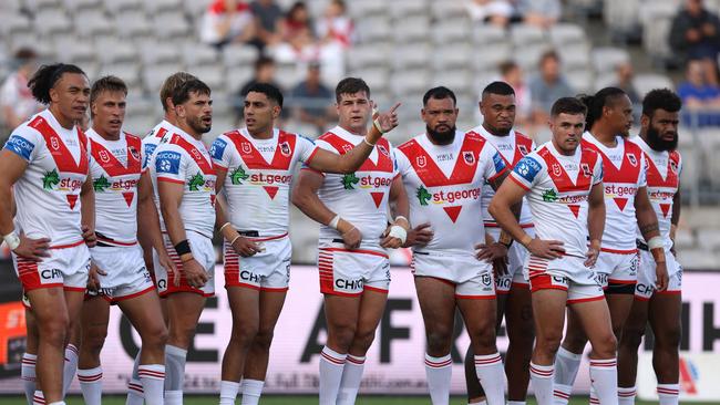 Dragons players look on after conceding yet another try. Picture: Getty Images