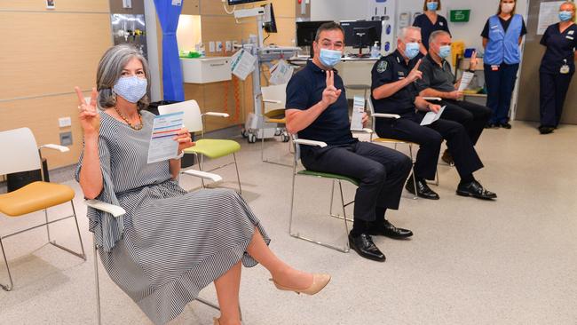 Professor Nicola Spurrier, Premier Steven Marshall and Police Commissioner Grant Stevens signal after getting their second vaccines at the RAH. Picture: Brenton Edwards