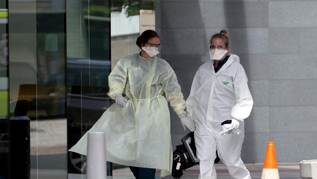 Emergency personnel are seen in full hazmat gear entering Peppers Broadbeach on the Gold Coast. Picture: MEGA TheMegaAgency.com