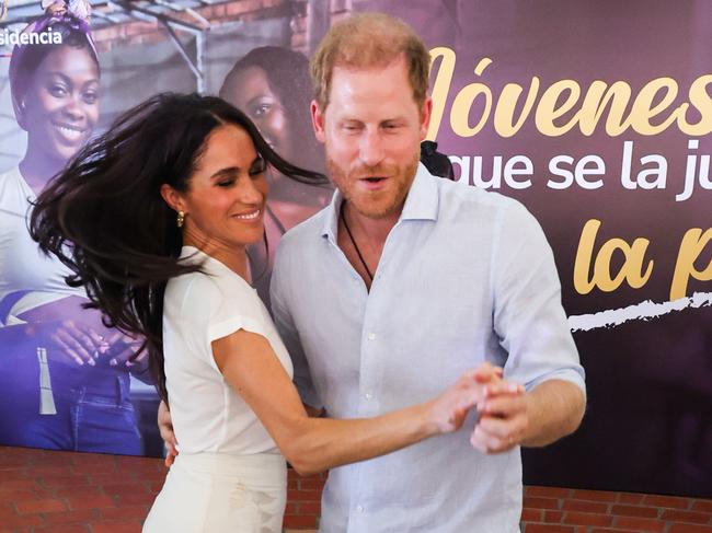 The royal with wife Meghan Markle during their Colombian tour. Picture: Getty Images